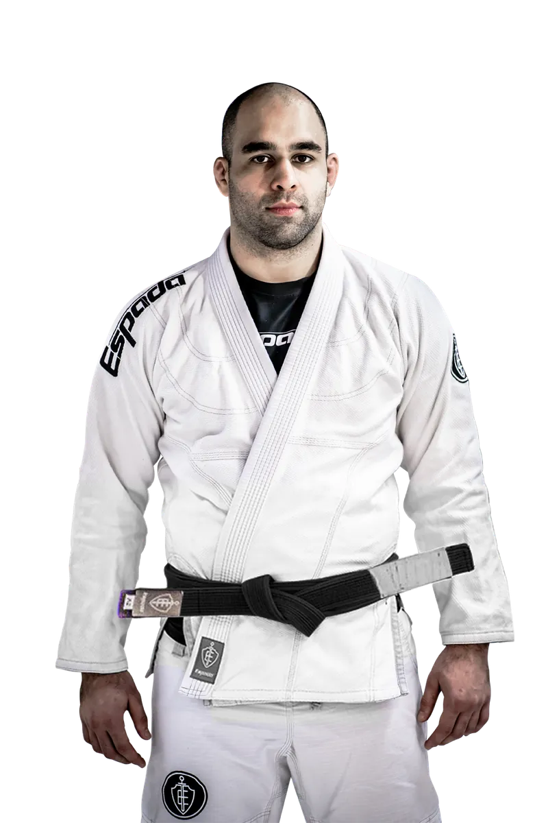 Nosh Khan in a white gi with black belt