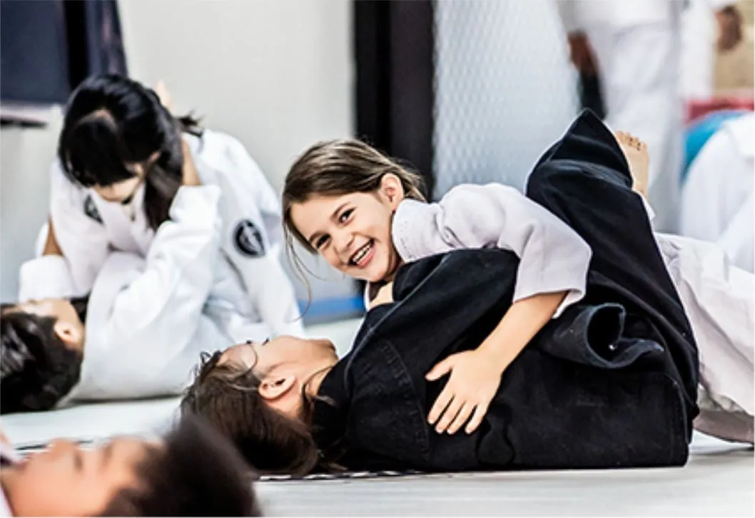 Smiling child practising jiu-jitsu